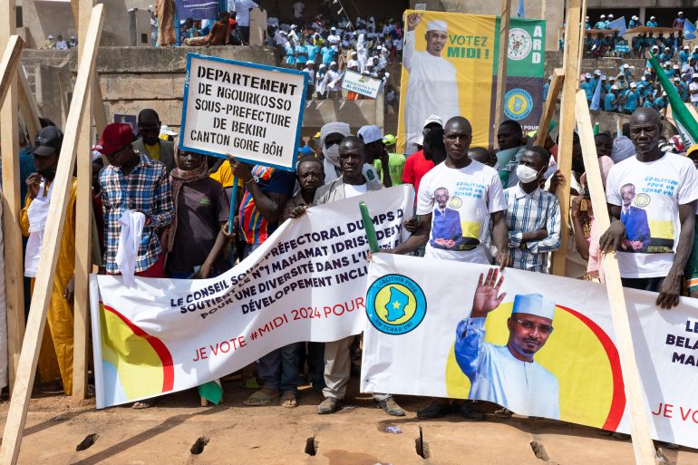 Supporters of Mahamat Deby display his banner