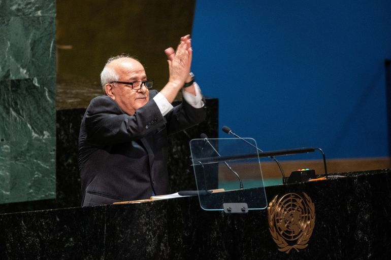 Palestinian Ambassador to the United Nations Riyad Mansour gestures to delegate