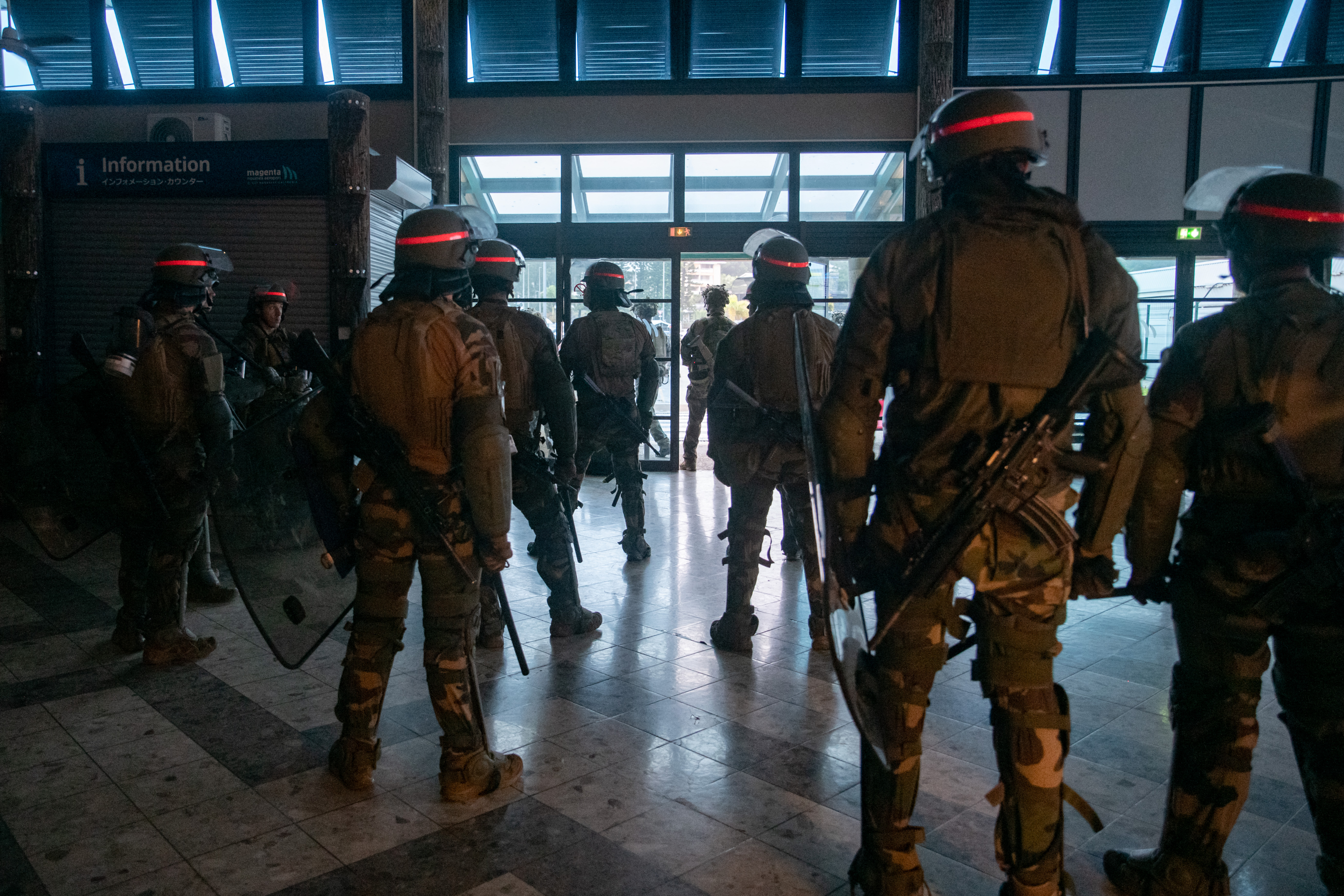 French soldiers of the 8th Marine Infantry Regiment (8e RIMa) secure the Magenta airport in Noumea, France's Pacific territory of New Caledonia, on May 17