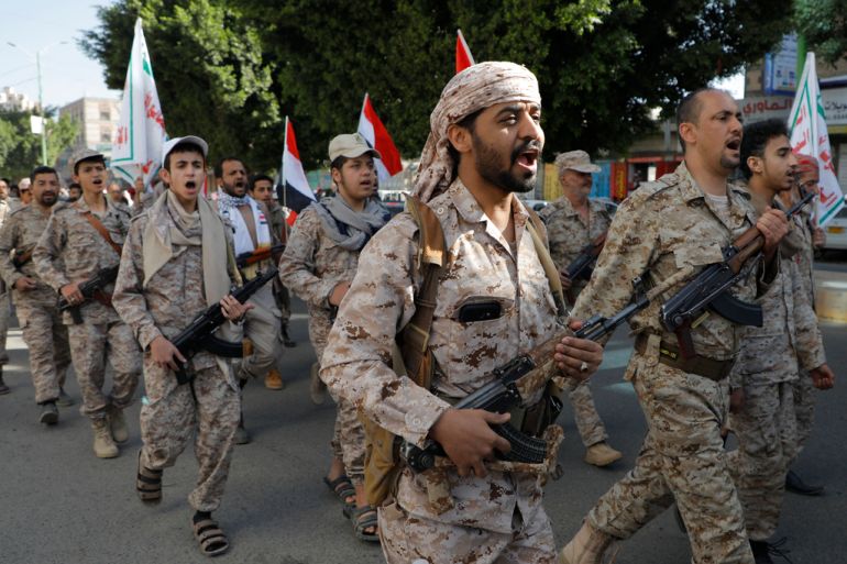 Houthi supporters march marking the anniversary of Yemeni unity in Sanaa, Yemen