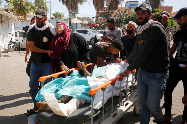 The dead and wounded, including children, are brought to al-Aqsa Martyrs Hospital