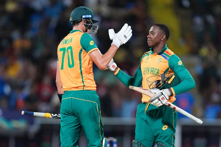 South Africa's Marco Jansen, left, and teammate Kagiso Rabada celebrate