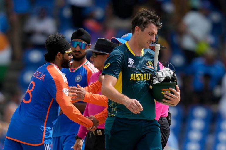 Australia's Pat Cummins walks off the field after his side lost by 24 runs against India in an ICC Men's T20 World Cup cricket match at Darren Sammy National Cricket Stadium in Gros Islet, Saint Lucia, Monday, June 24, 2024. (AP Photo/Ramon Espinosa)