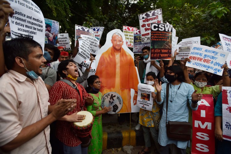 Members of various groups gathered aroud a cut-out of UP Chief Minister Yogi Adityanath while demonstrating against the Hathras incident and crimes against women, at Jantar Mantar