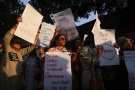 Members of the media protest at the Press Club of India in New Delhi [File: Anushree Fadnavis/Reuters]