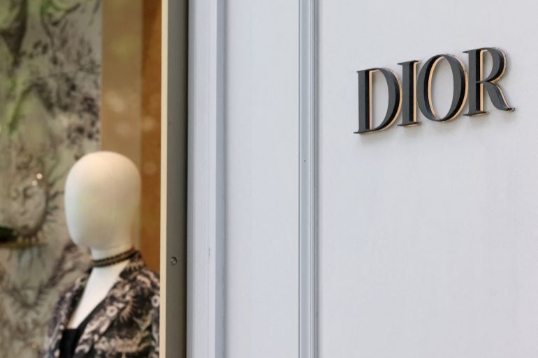 A logo of fashion house Dior is seen outside a shop in Paris