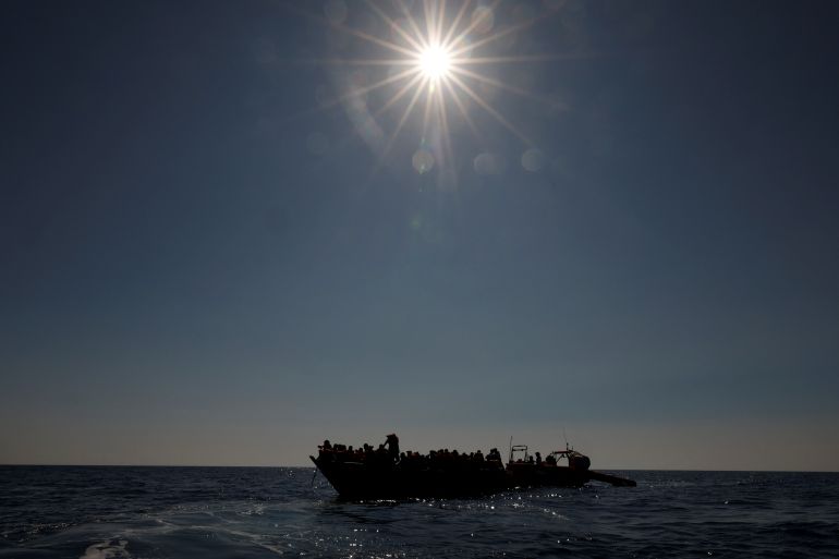 Migrants are rescued from a wooden boat by the Geo Barents migrant rescue ship