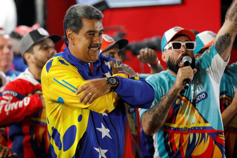 Venezuelan President Nicolas Maduro celebrates after the presidential election in Caracas