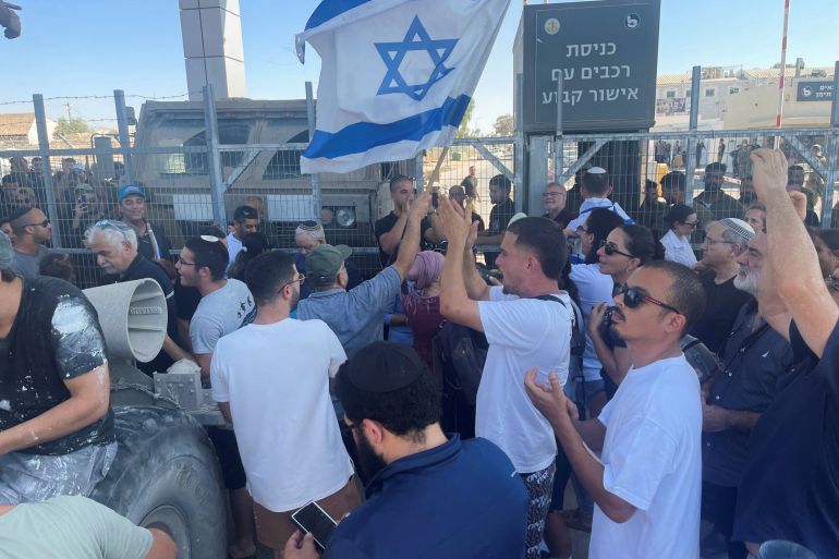 Right-wing protesters wave Israeli flags outside Sde Teiman detention facility