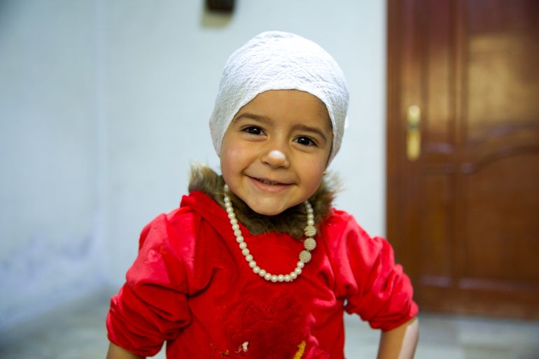 Girl in red clothes smiling