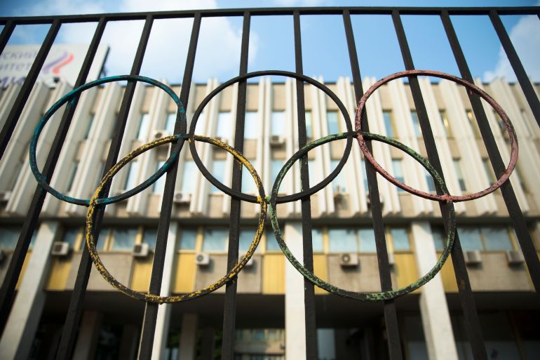 The Olympics rings are seen on a fence in front of the Russian Olympic Committee building in Moscow, Russia, Sunday, July 24, 2016. The IOC has decided against a complete ban on Russian athletes from the Olympics in Rio de Janeiro. The International Olympic Committee says it is leaving it up to global federations to decide which Russian athletes to accept in their sports. (AP Photo/Pavel Golovkin)