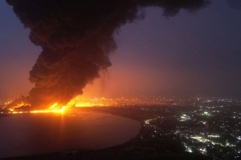 Oil tanks burn at the port in Hodeidah