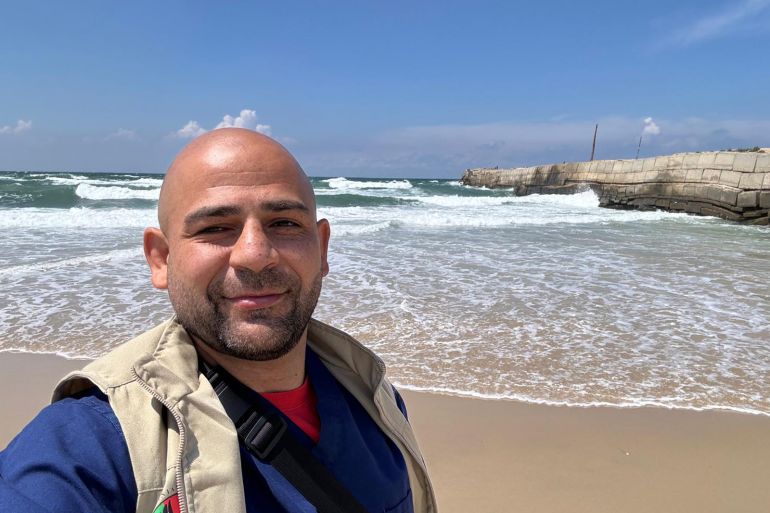 Omar Sabha takes a selfie on the sandy shores of the Mediterranean Sea