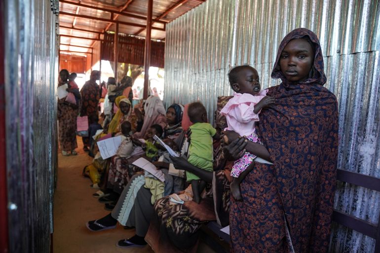 A handout photograph, shot in January 2024, shows a woman and baby at the Zamzam displacement camp, close to El Fasher in North Darfur, Sudan. An assessment by Medecins Sans Frontieres (Doctors Without Borders) in January found that at the camp, which is home to an estimated 400,000 people, two babies were dying every hour. Nearly 40% of children aged six months to two years old were malnourished, the group found. MSF/Mohamed Zakaria/Handout via REUTERS THIS IMAGE HAS BEEN SUPPLIED BY A THIRD PARTY. MANDATORY CREDIT