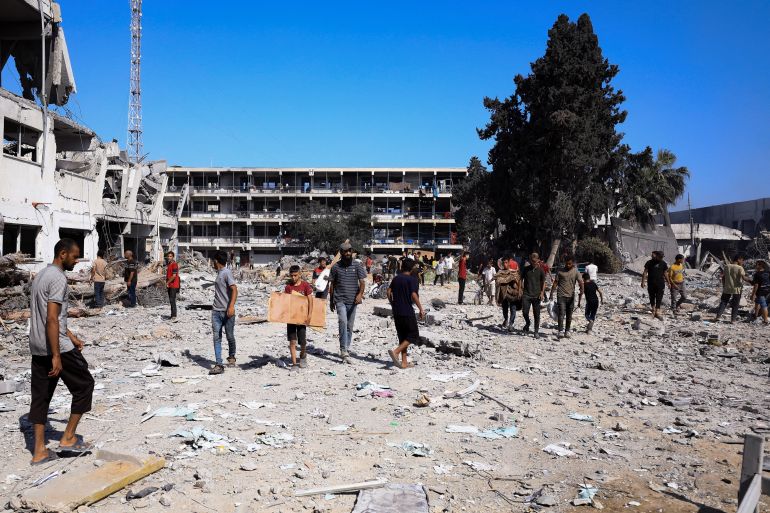 Palestinians gather to inspect the damages at the headquarters of UNRWA, following an Israeli raid, amid the Israel-Hamas conflict, in Gaza City, July 12, 2024. REUTERS/Dawoud Abu Alkas