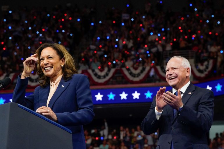 Kamala Harris and Tim Walz on stage in Philadelphia