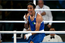 Algeria&#039;s Imane Khelif celebrates after beating Thailand&#039;s Janjaem Suwannapheng in the women&#039;s 66kg boxing semifinal at the Roland-Garros Stadium in Paris [Mauro Pimentel/AFP]