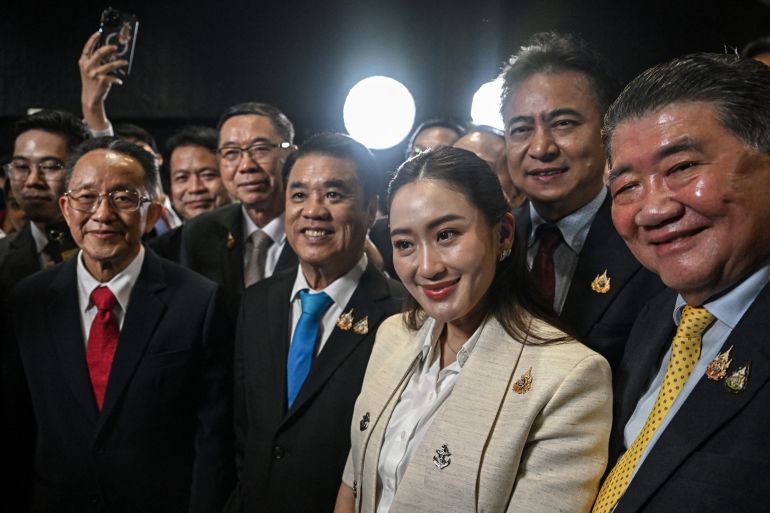 Thailand's new Prime Minister Paetongtarn Shinawatra (centre R), known by her nickname "Ung Ing" and daughter of former prime minister Thaksin Shinawatra, stands with top Pheu Thai party members during a press conference in Bangkok on August 16, 2024