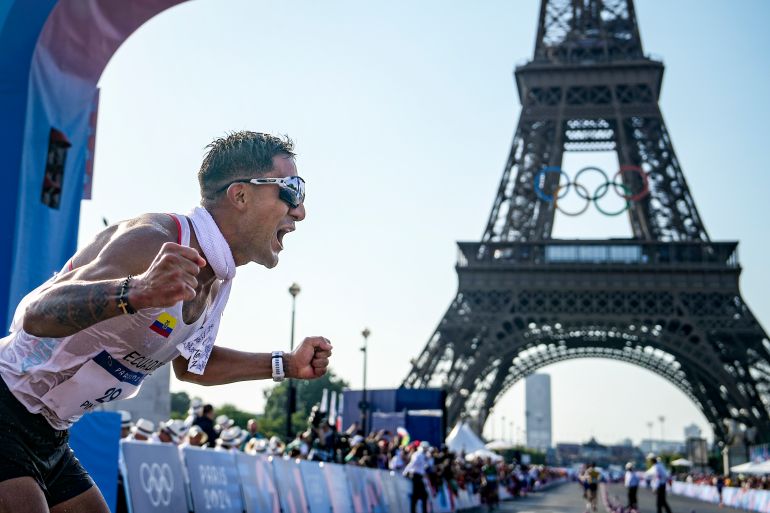 Brian Daniel Pintado, of Ecuador, celebrates after winning the gold medal at the end of the men's 20km race walk at the 2024 Summer Olympics, Thursday, Aug. 1, 2024, in Paris, France. (AP Photo/Vadim Ghirda)