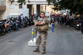 A soldier on duty near American University of Beirut Medical Center after 2,750 people, including Hezbollah fighters and medics, were wounded when the pagers they use to communicate exploded simultaneously across Lebanon on September 17, 2024 [Mohamed Azakir/Reuters]