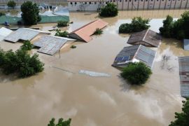 Houses submerged under floodwaters in Maiduguri. [Audu Marte/AFP]