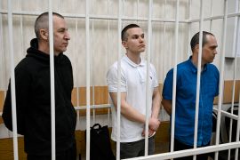 The three lawyers who used to represent Alexey Navalny: Igor Sergunin, Alexei Liptser and Vadim Kobzev (L-R) in the defendants&#039; cage [Alexander Nemenov/AFP]