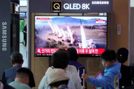 A TV screen shows a file image of North Korea&#039;s missiles launch at a railway station in the South Korean capital, Seoul [Ahn Young-joon/AP]