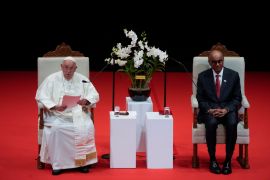 Pope Francis addresses Singapore&#039;s President Tharman Shanmugaratnam, right, and the audience during a meeting at the Cultural Centre of the National University of Singapore, September 12, 2024 [Gregorio Borgia/AP Photo]