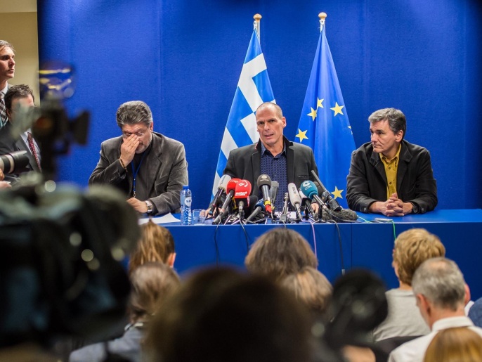 Greece's Finance Minister Yanis Varoufakis, 2nd right, addresses the media after a meeting of Eurogroup finance ministers at the EU Council building in Brussels on Monday, Feb. 16, 2015. Greece’s radical left government and its European creditors headed into new talks Monday on the debt-heavy country’s stuttering bailout program, but expectations are low despite a fast-approaching deadline for some kind of deal. (AP Photo/Geert Vanden Wijngaert)