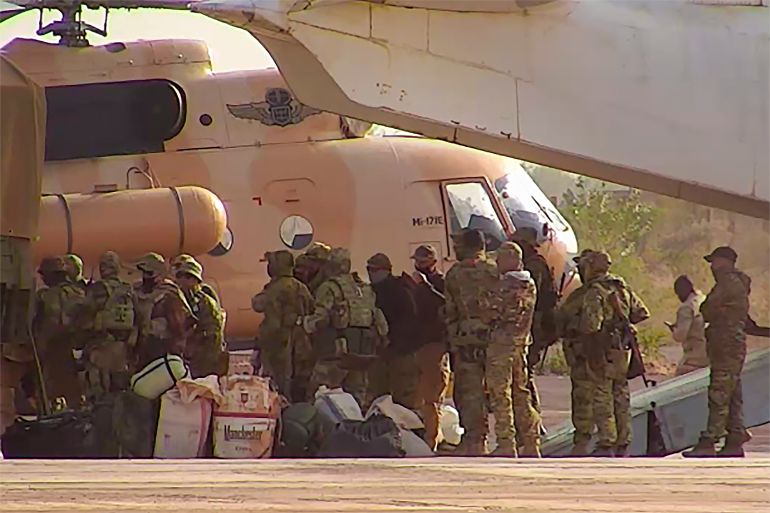 This undated photograph handed out by French military shows Russian mercenaries boarding a helicopter in northern Mali. Russia has engaged in under-the-radar military operations in at least half a dozen countries in Africa in the last five years using a shadowy mercenary force analysts say is loyal to President Vladimir Putin. The analysts say the Wagner Group of mercenaries is also key to Putin's ambitions to re-impose Russian influence on a global scale. (French Army via AP)