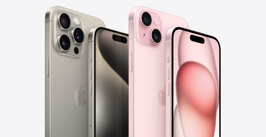 iPhone 15 Pro Max and iPhone 15 Pro in Natural Titanium are pictured next to iPhone 15 Plus and iPhone 15 in Pink.