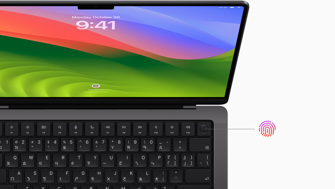 MacBook Pro 螢幕顯示使用 Touch ID 進行解鎖的畫面。
