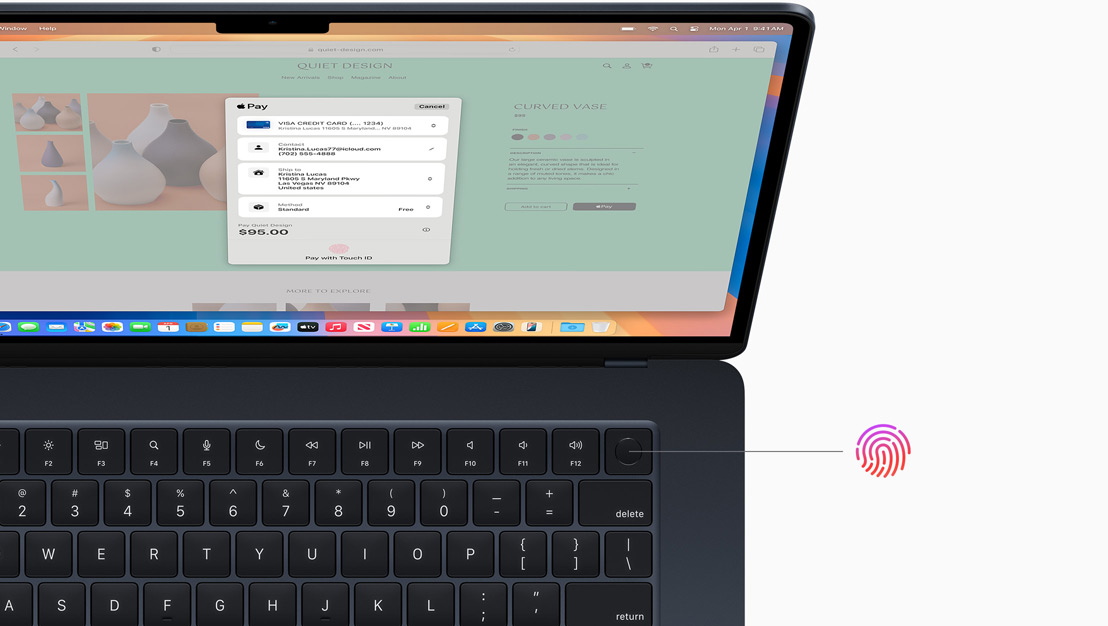 An open MacBook Pro in Space Black, demonstrating the location of the Touch ID button.