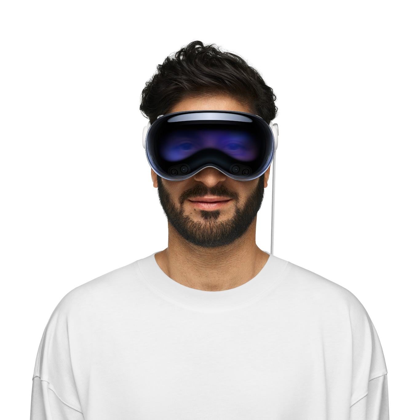 Person wearing Apple Vision Pro, with eyes revealed through an outward display