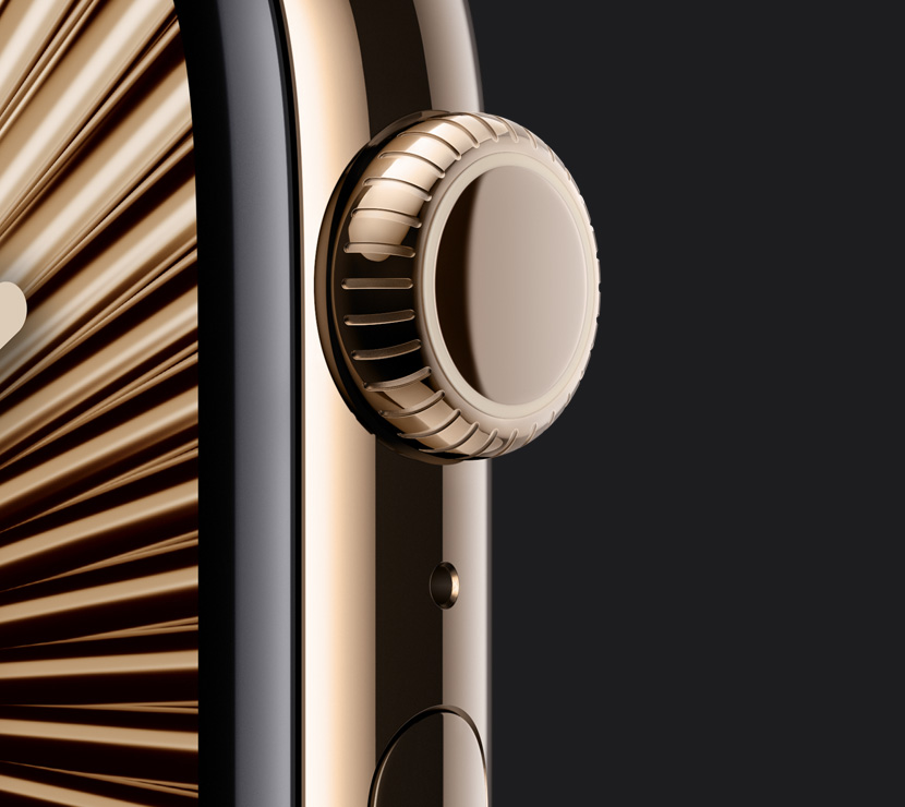 The Natural titanium finish, Gold titanium finish and Slate titanium finish of three Apple Watch Series 10 cases with a close-up of the side of their Digital Crowns. An interactive finish selector is below them.