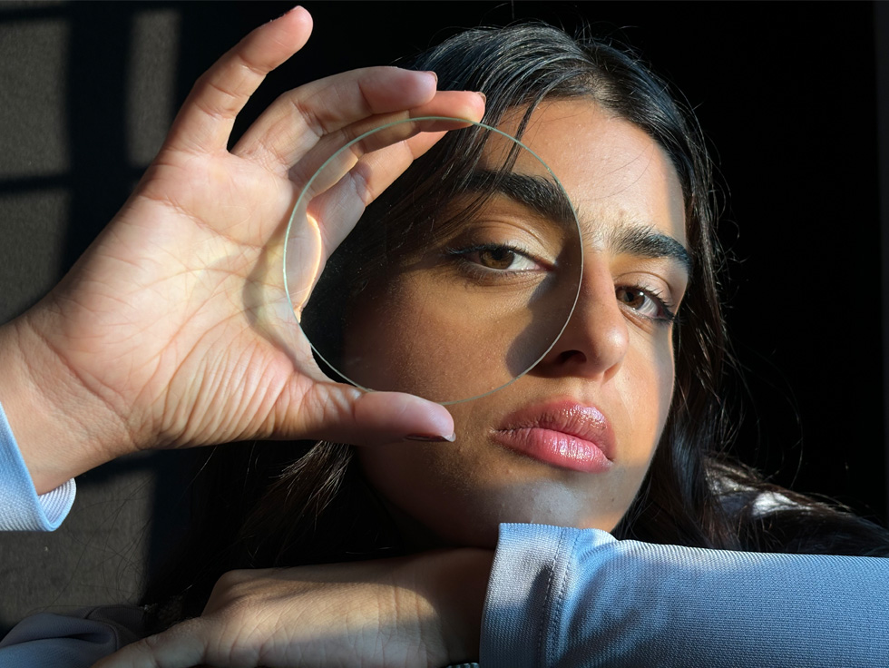 Close-up photo of a women demonstrating 2x Telephoto zoom level