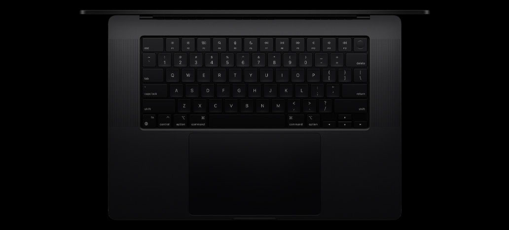 MacBook Pro sedd ovanifrån. På bilden syns det inbyggda tangentbordet Magic Keyboard med Touch ID och styrplatta