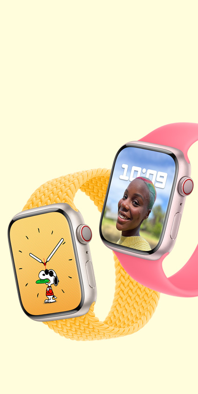 Image montrant deux Apple Watch Series 9, la première avec un cadran Snoopy et un bracelet solo tressé rayon de soleil, et la deuxième avec un cadran Portraits et un bracelet solo rose.