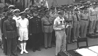 General  Douglas MacArthur opens the Japanese surrender ceremony on the USS Missouri on 2 September 1945. Leading Allied Officers are behind him