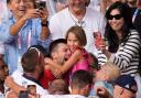 An emotional Novak Djokovic embraces his daughter Tara (Manu Fernandez/AP)