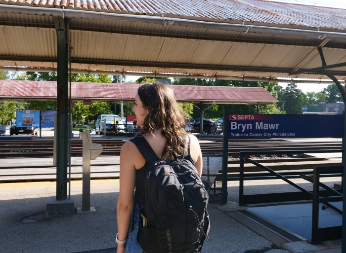 student waits for a train