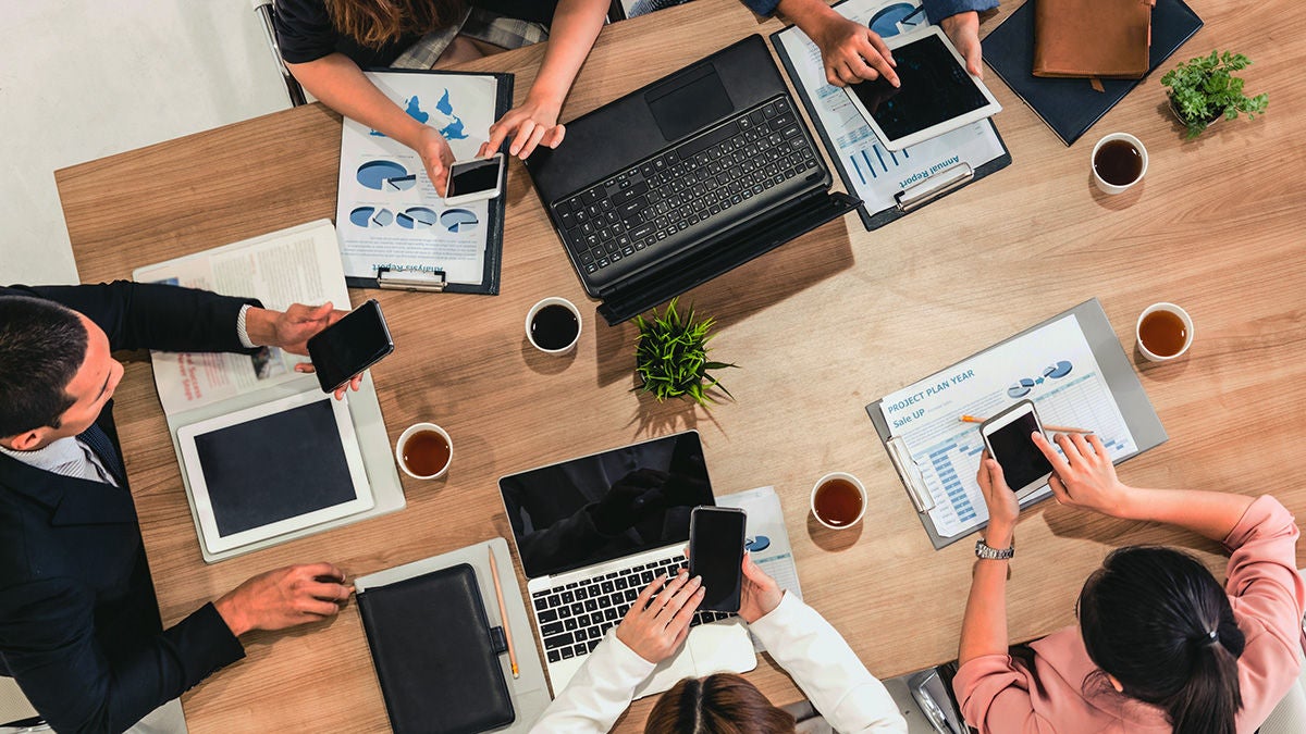 Co-workers collaborating at table