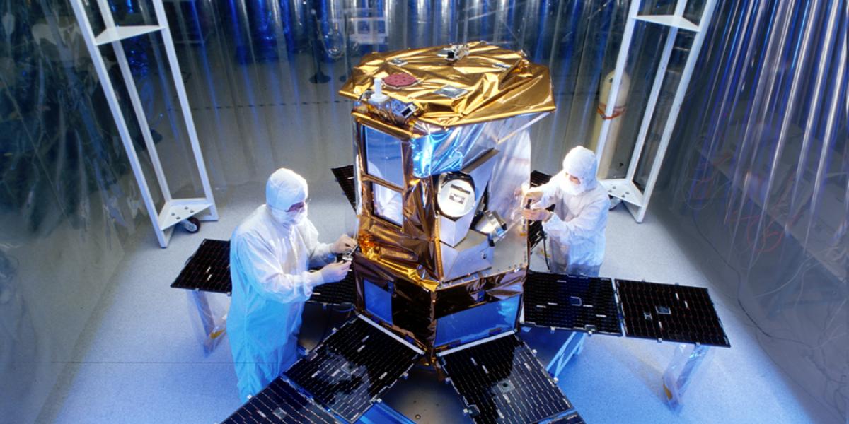 working on satellite in clean room