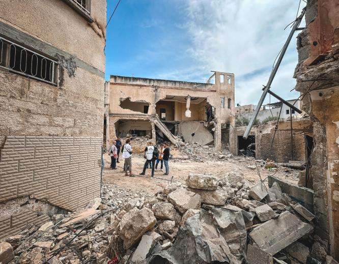 An MSF team surveys the destruction caused by an Israeli incursion in the West Bank. 