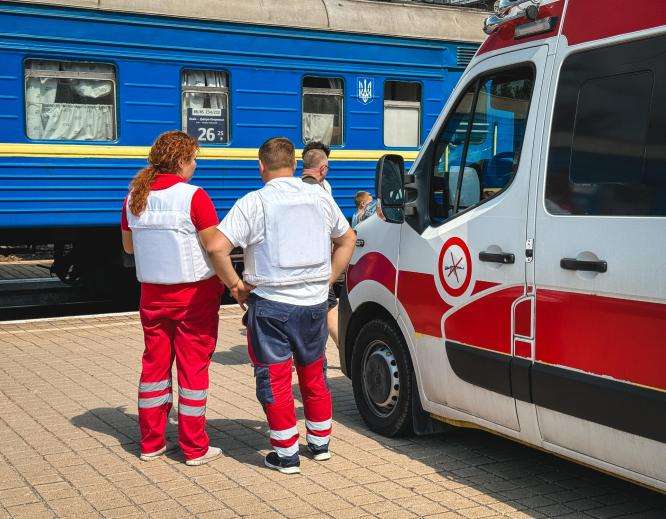 MSF staff members stand by an ambulance on the train platform in Pokrovsk, Ukraine.