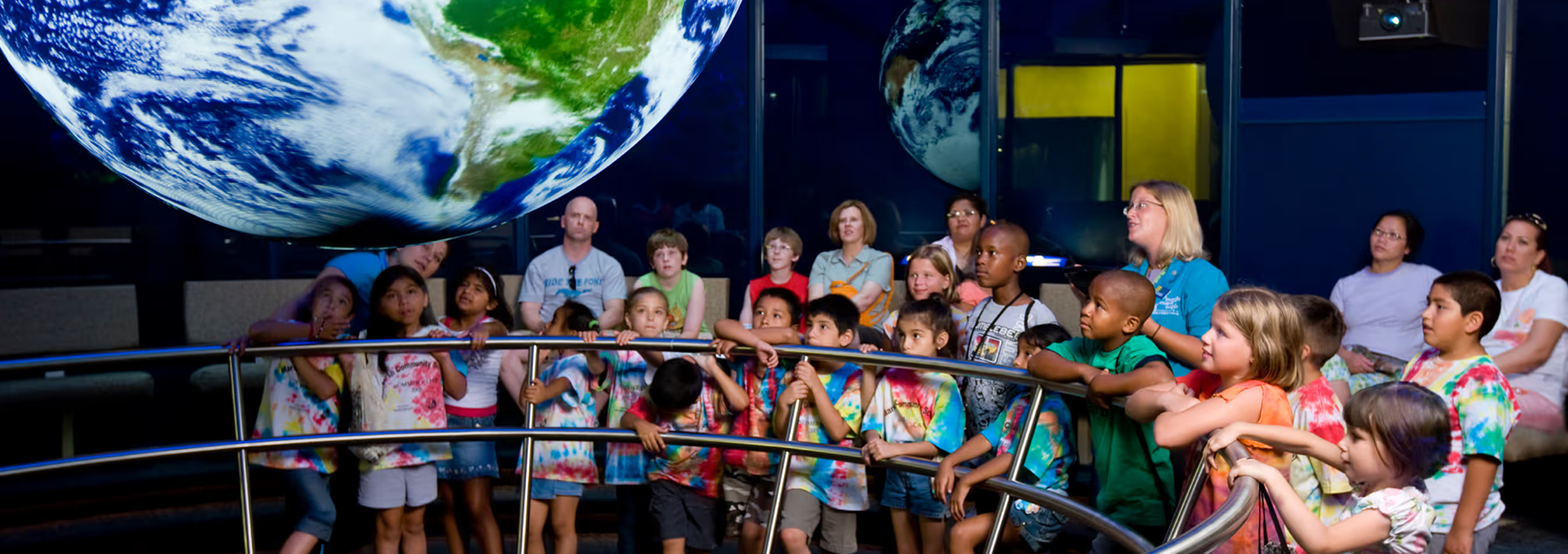 visitors view Science On a Sphere, link to article