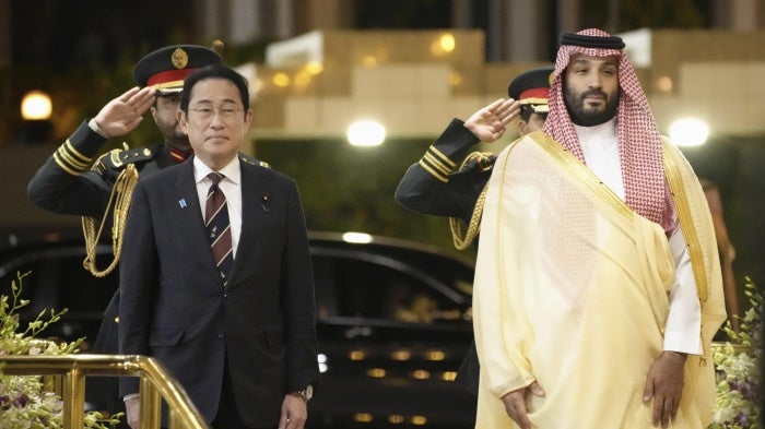 Japanese Prime Minister Fumio Kishida and Saudi Arabian Crown Prince Mohammed bin Salman attend Kishida's welcome ceremony in Jeddah, Saudi Arabia, July 16, 2023.