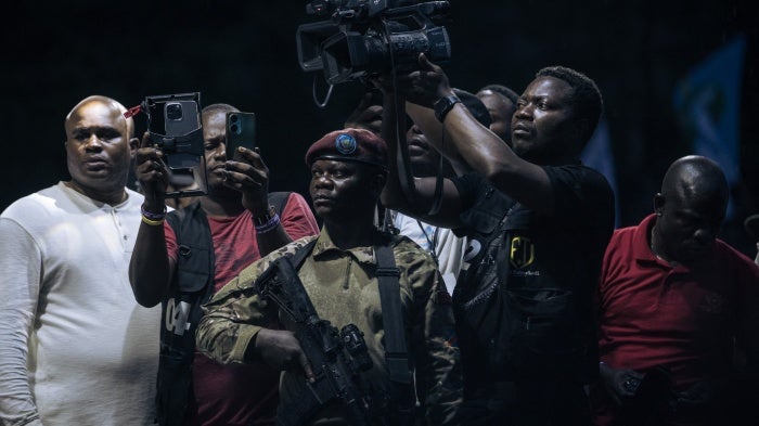 Journalists attend an election rally for president President Felix Tshisekedi in Goma, North Kivu province, Democratic Republic of Congo, on December 10, 2023.