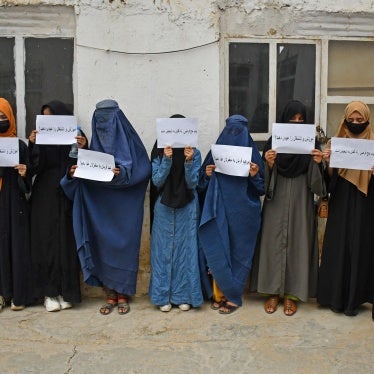 Afghan women hold placards demanding their right to education, in Mazar-i-Sharif on June 26, 2023. 