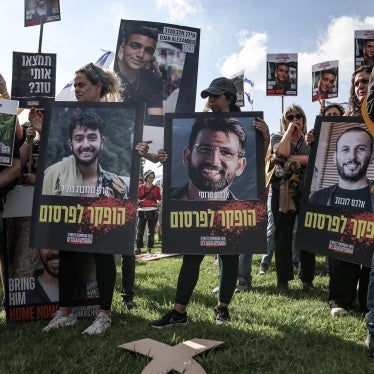 Relatives and supporters of Israeli hostages taken captive in the Gaza Strip carry pictures of Hersh Goldberg-Polin (L), Almog Sarusi (C) and Alexander Lobanov and other hostages as they protest outside the prime minister's office in Jerusalem on September 1, 2024. 